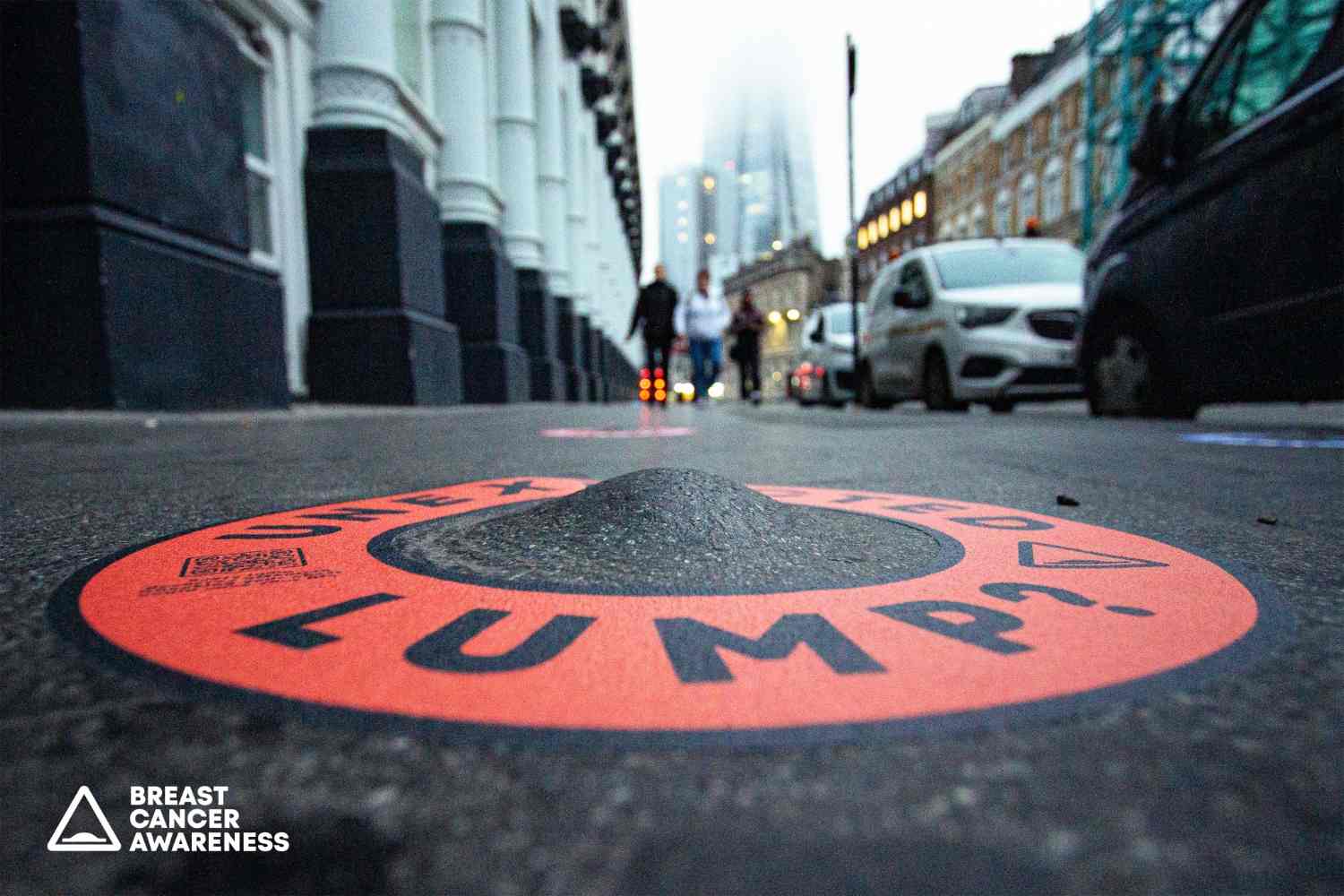 Special sidewalk bumps raising awareness for breast cancer self-examination importance